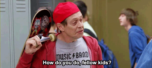 Meme: Steve Buscemi in white male in his 50s in the TV show 30 Rock, dressed in t-shrt and hoodie with baseball cap on backwards says "how do you do, fellow kids?" to a group high schooler all while carrying a skatebaord over his shoulder.