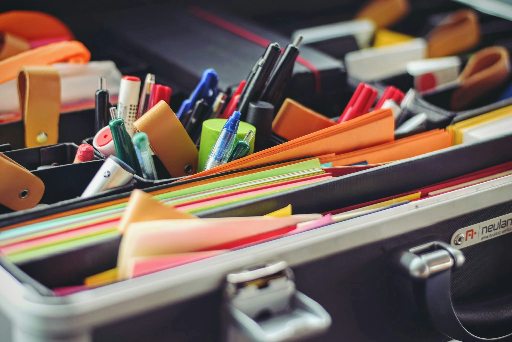 stationary supplies loosely organized in trays and bins